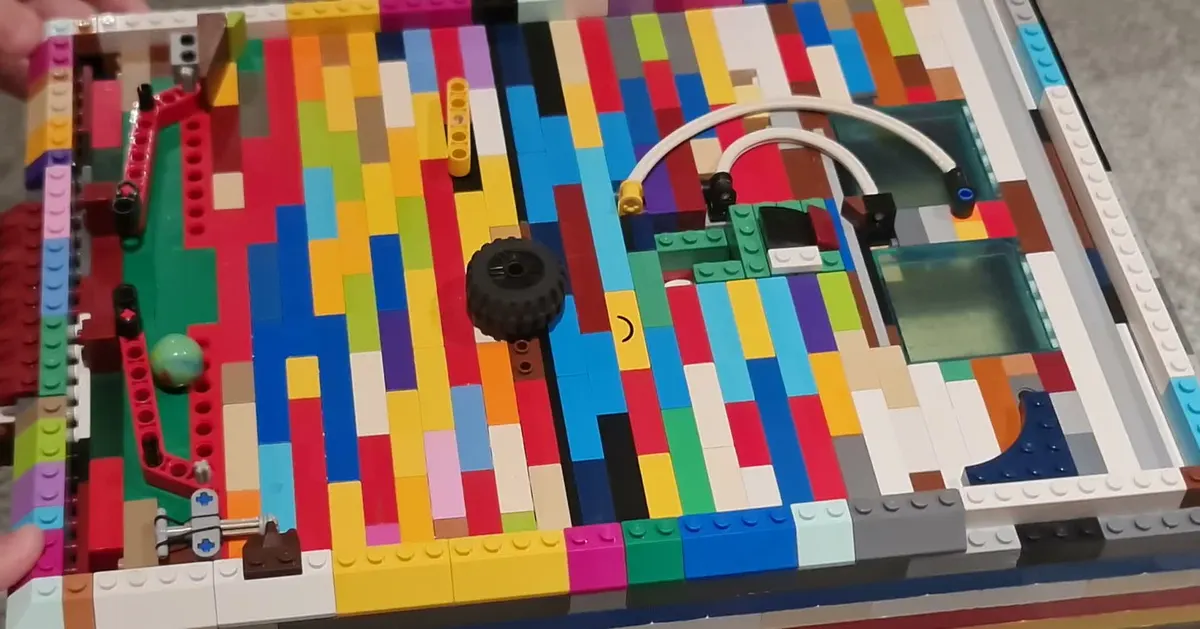 LEGO pinball machine — flippers, bumpers, marble physics